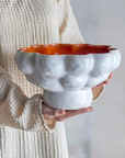 Schale mit Wellenrand weiss innen orange
