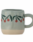 Tasse mit Kirschen